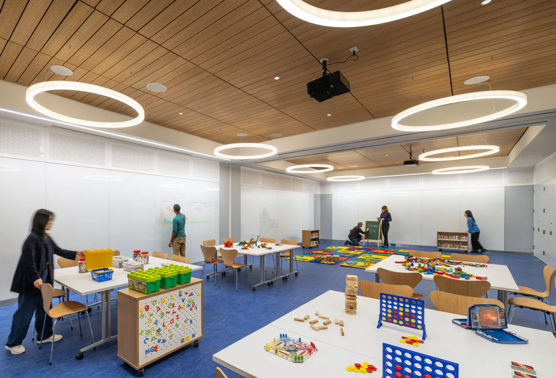 Rendering of Children's area of library with games, legos, dinosaurs, and Jenga