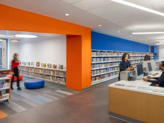 Rendering of People walking around library with orange highlight archway and dark blue walls