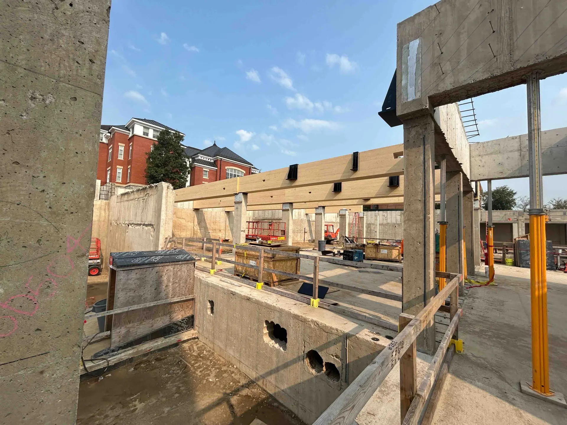 Concrete footing and foundation with cross timber beams at Amherst College