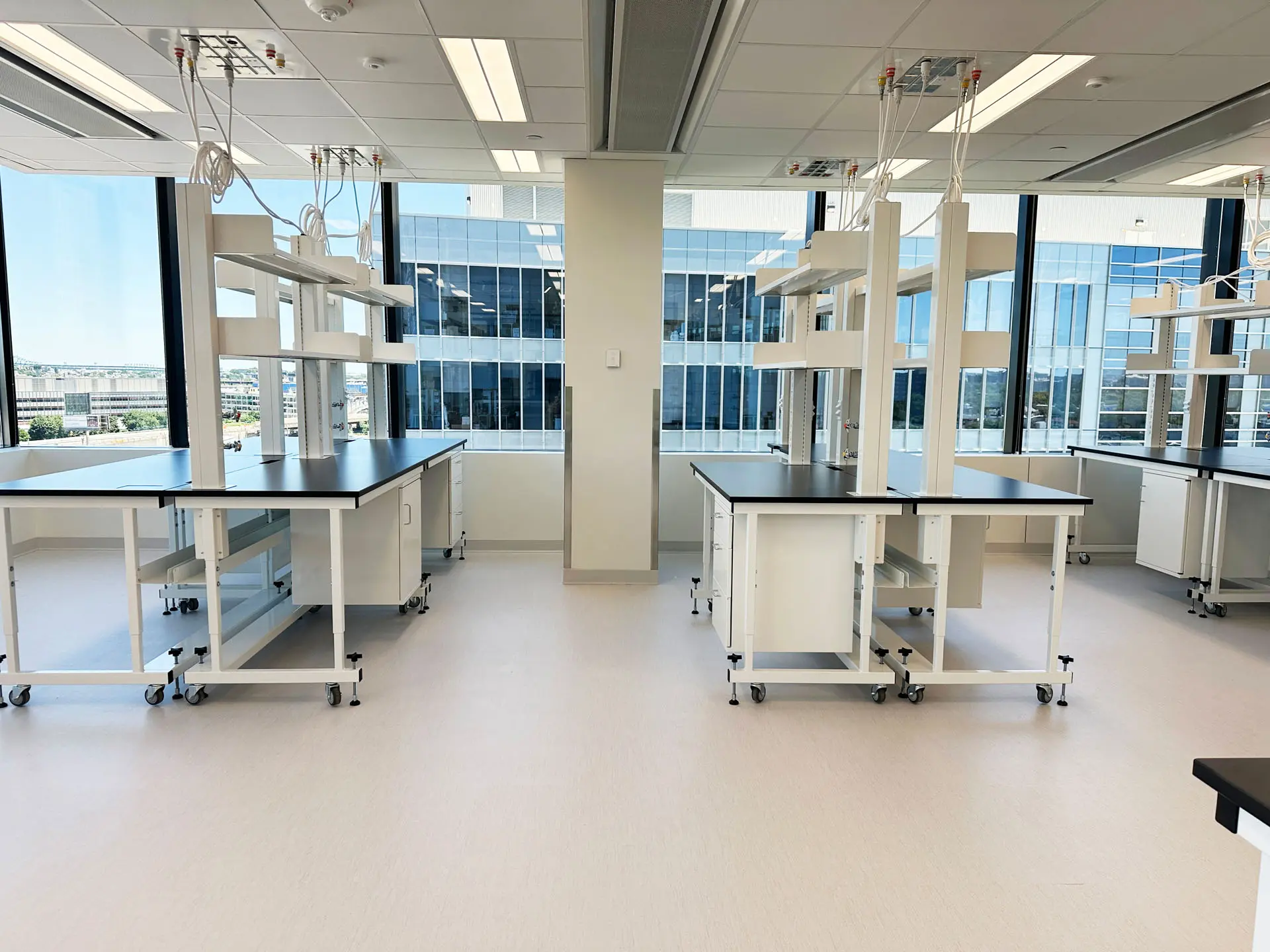 Laboratory space with tiled floors and black countertops