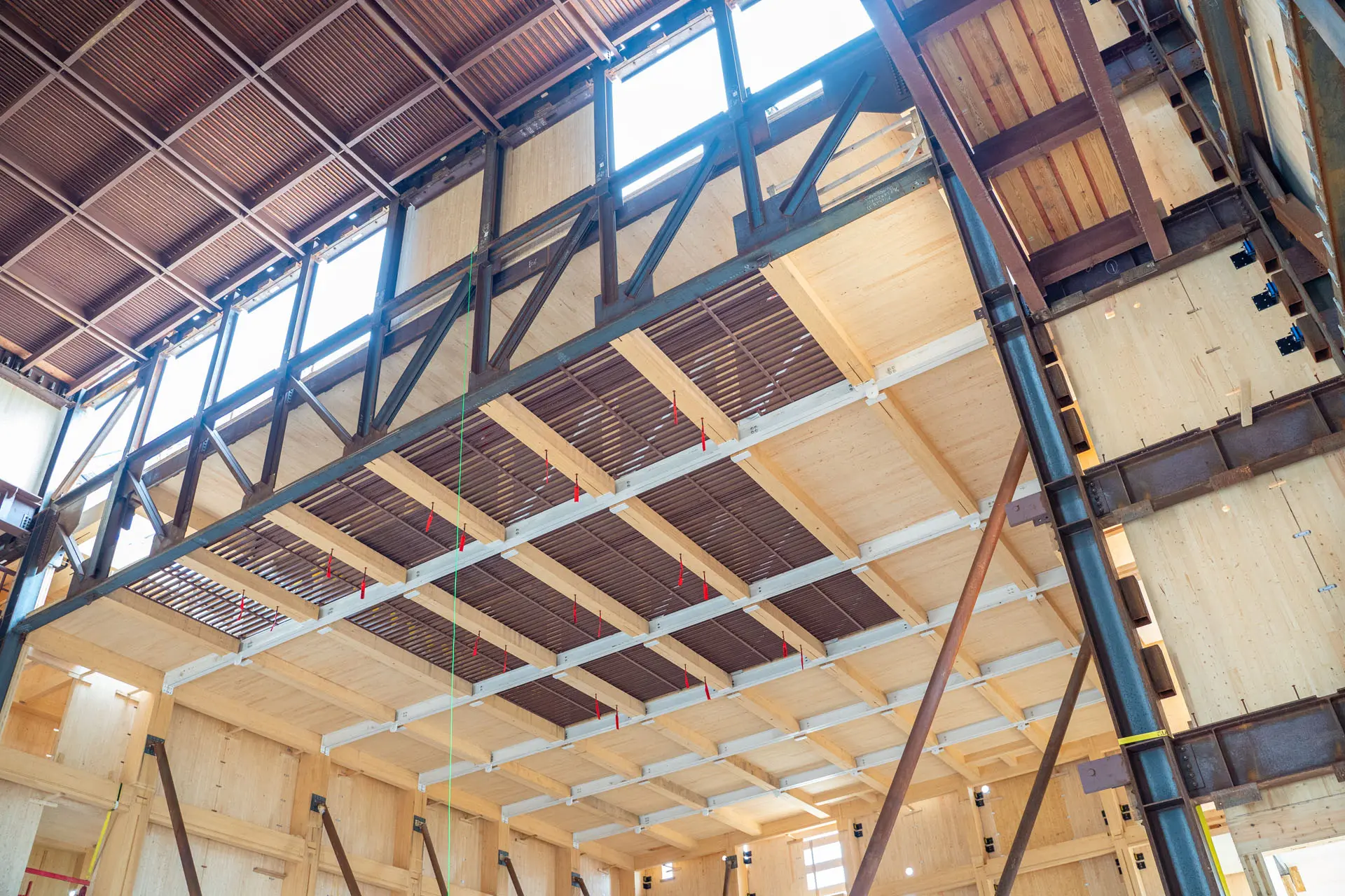 Interior image of under the second floor of steel and timber Harvard University American Repertory Theatre under construction