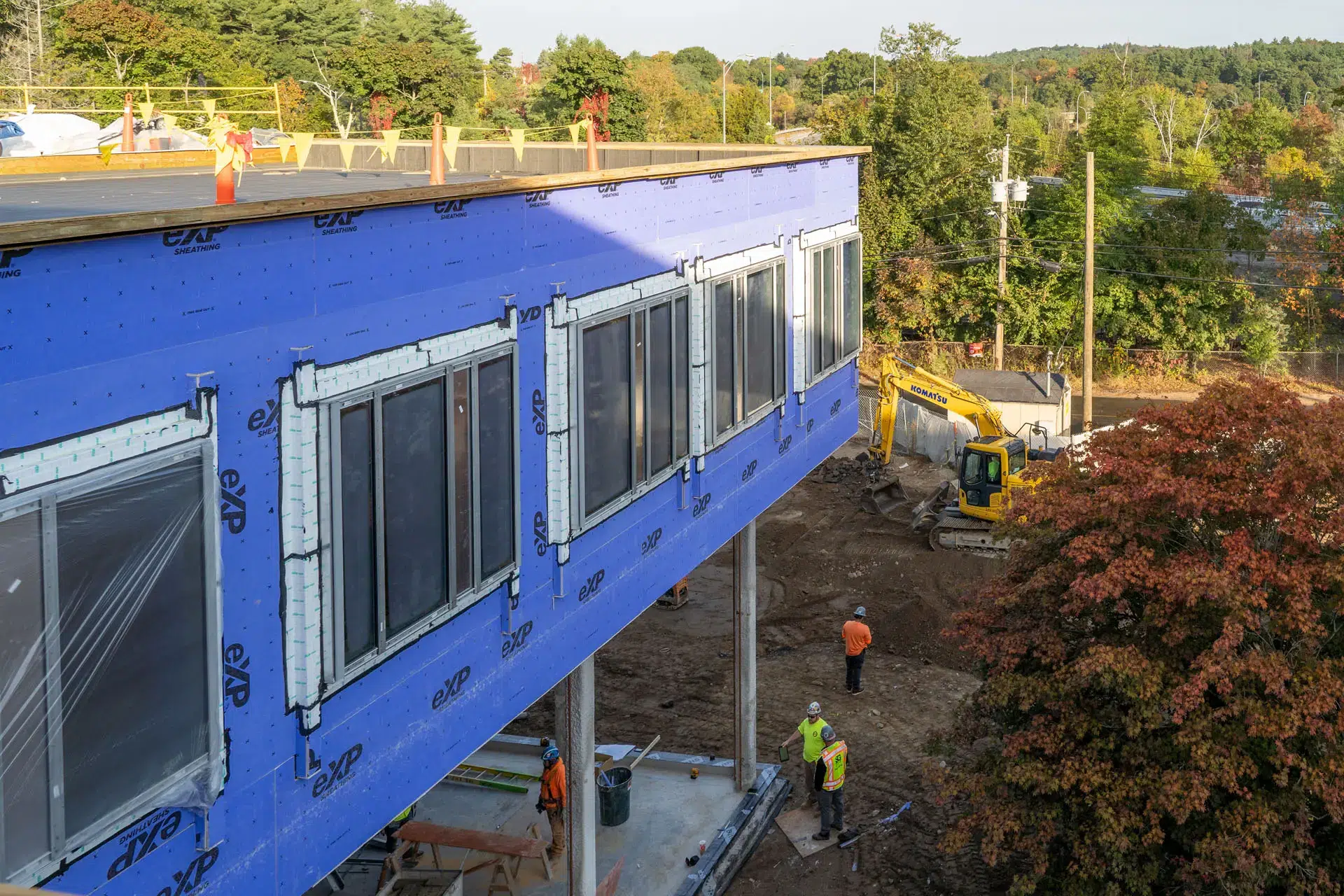 View from second story looking down on four workers on the Riverside Labs construction site