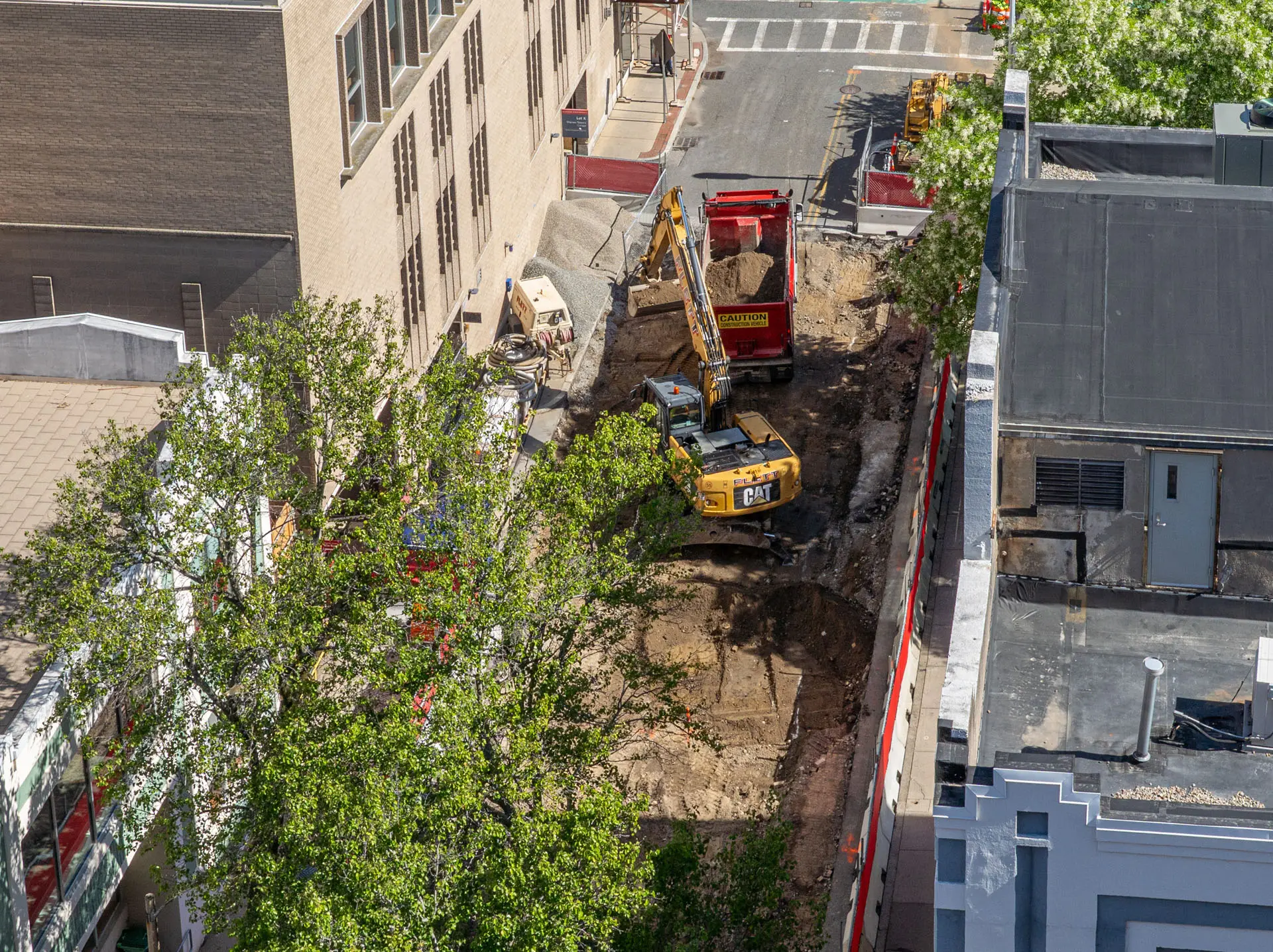 Bird eye view of dirt lot with construction vehicles
