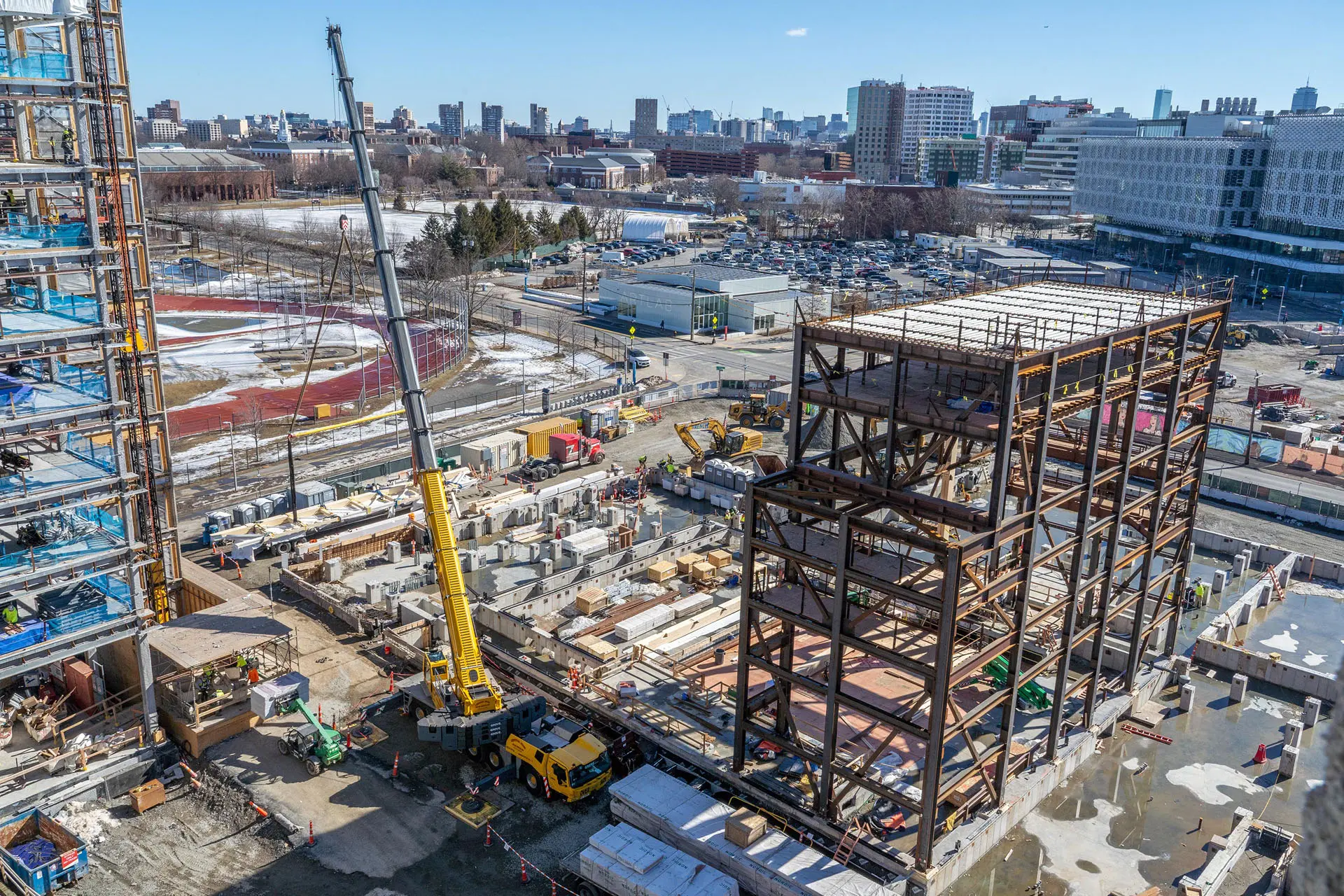 Drone footage of crane placing steel beams at Harvard University American Repertory Theatre