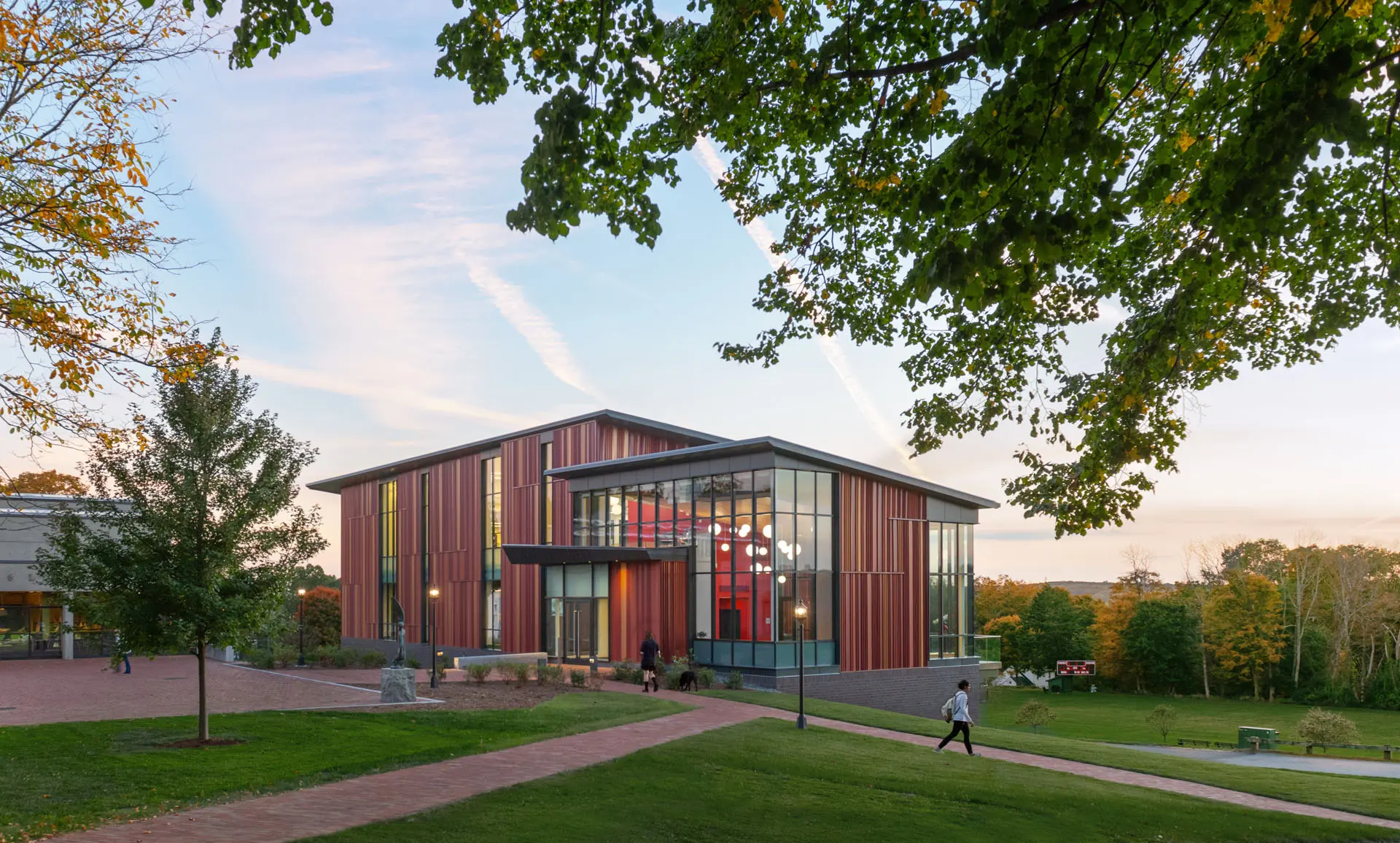 Image of red and glass Pomfret academy science lab at dusk