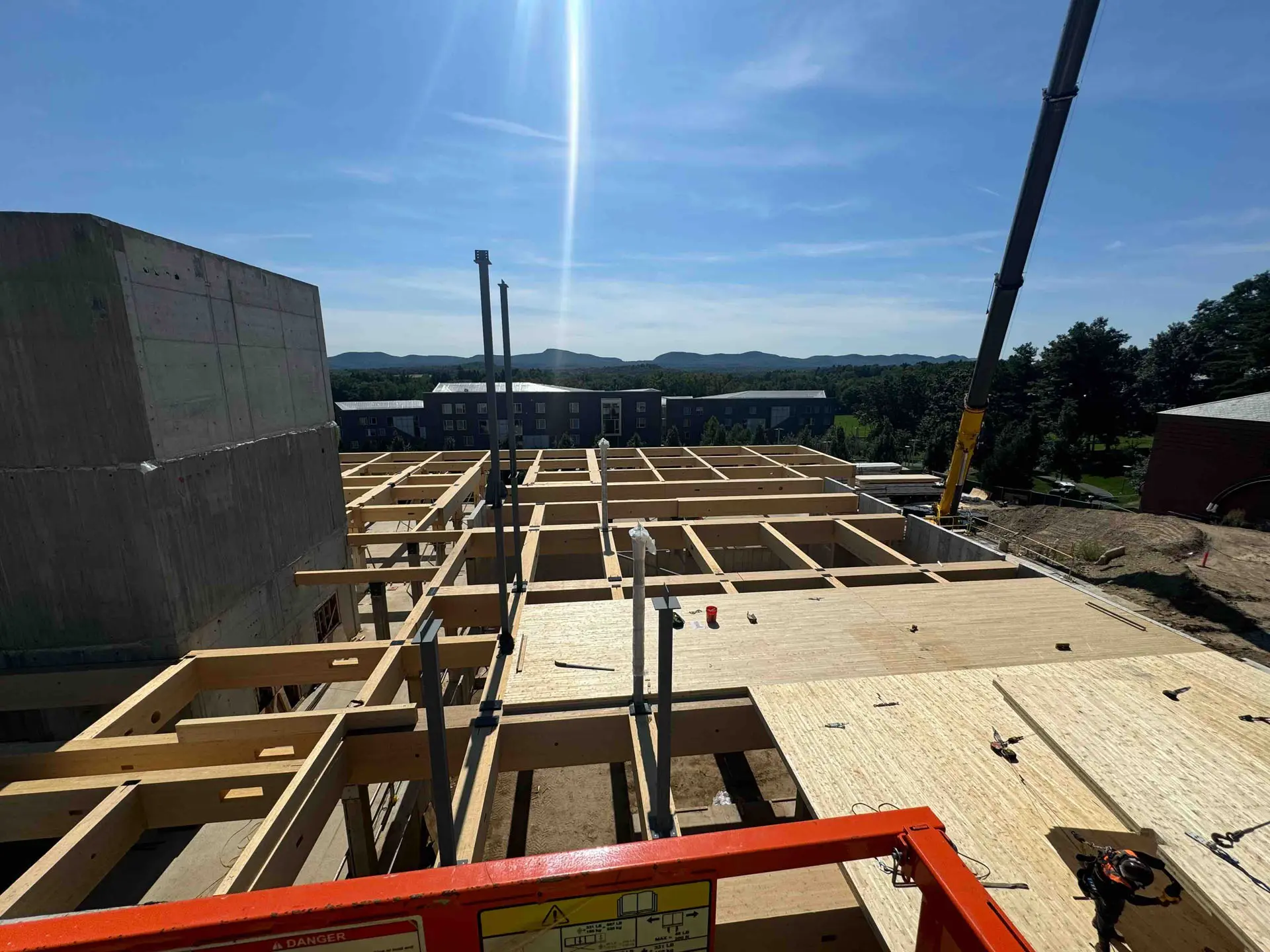 View from above of timber flooring on cross timber struts at Amherst College
