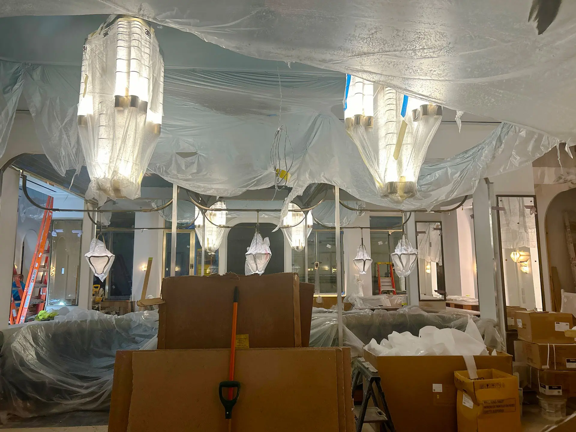 pendant lamps in hotel covered in plastic sheeting