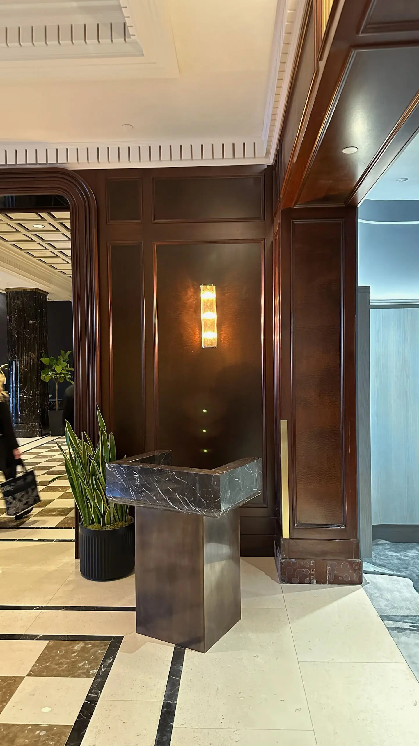 Corner of lobby with marble greeting podium