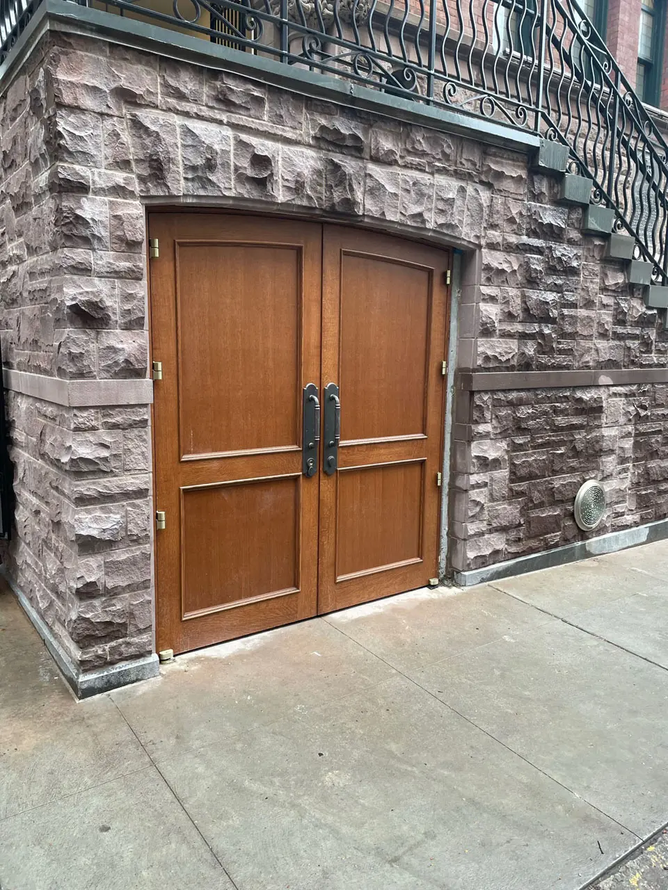 Wooden exterior door in stonework