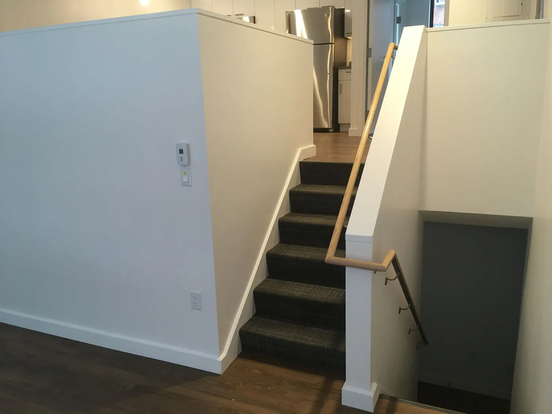 Staircase with wooden handrail