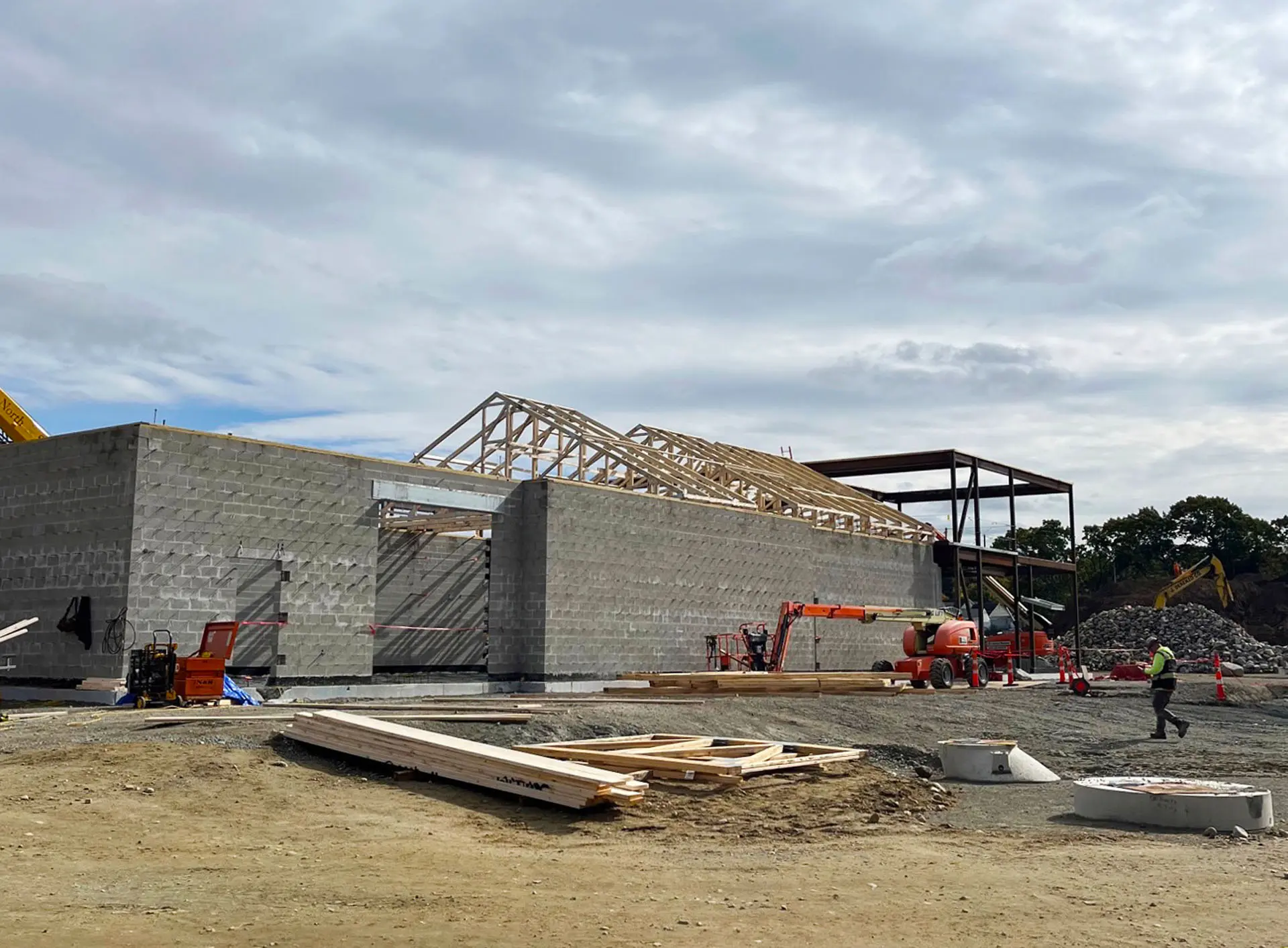 view from ground of cinderblock frame and wooden roof at Middleton Municipal Complex