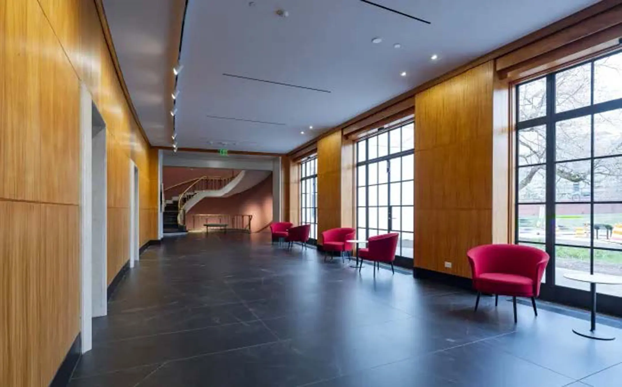 Chairs in hallway and curved stairwell