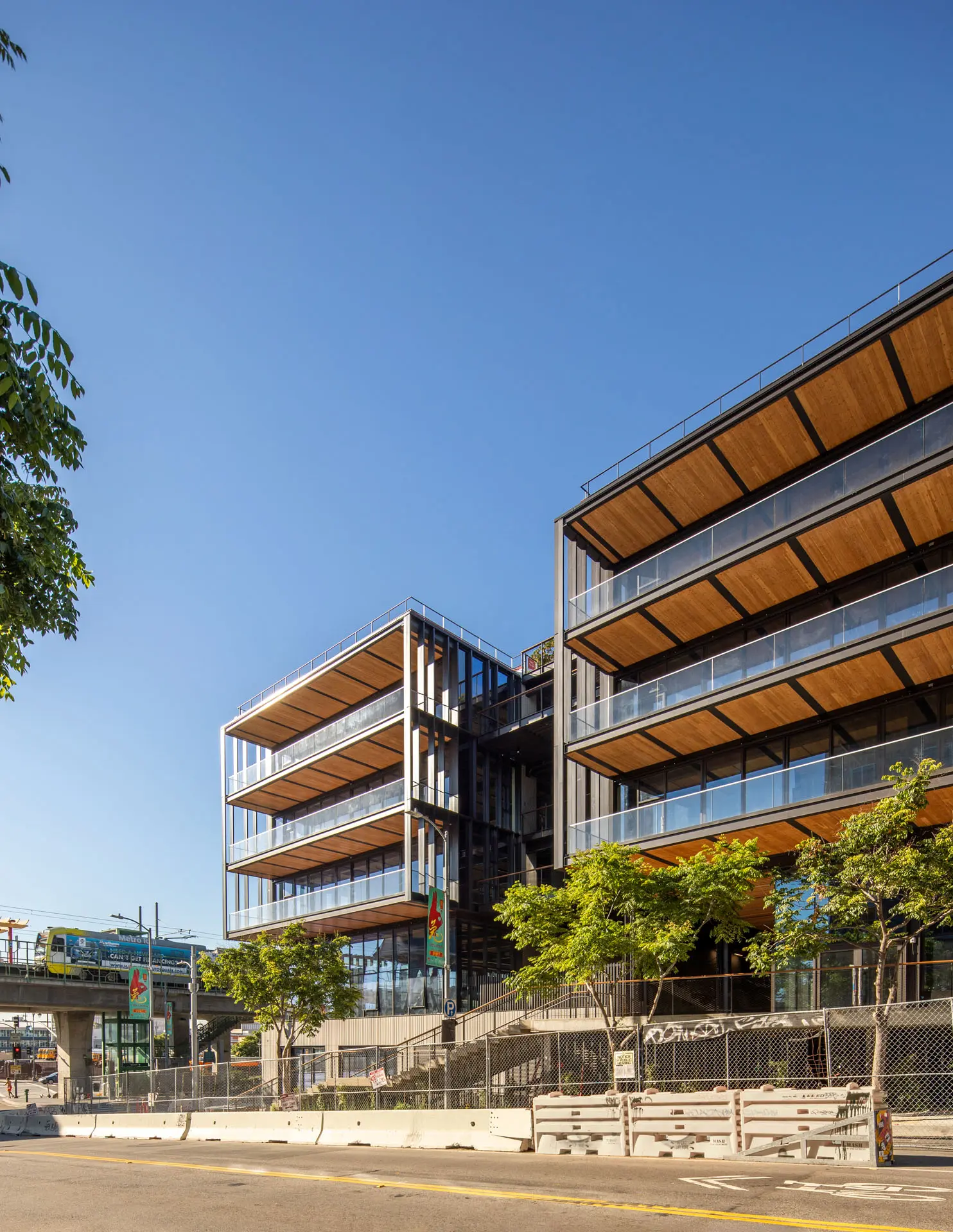 Photograph from roadway of wooden balcony floors of the 843 North Spring Street building