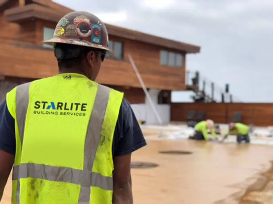 Person in Starlite safety vest on concrete construction site
