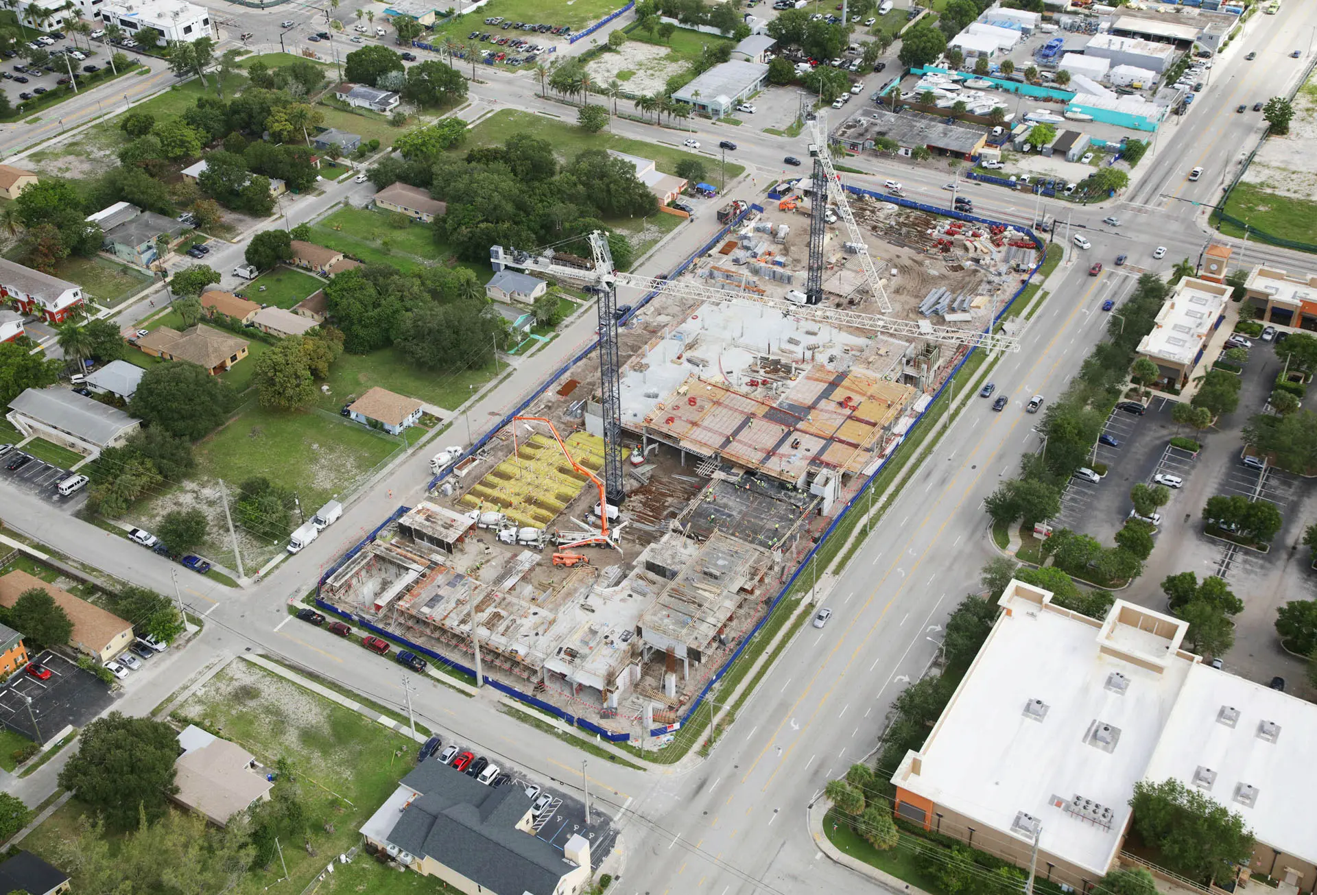 Overhead view of multiple cranes in construction zone