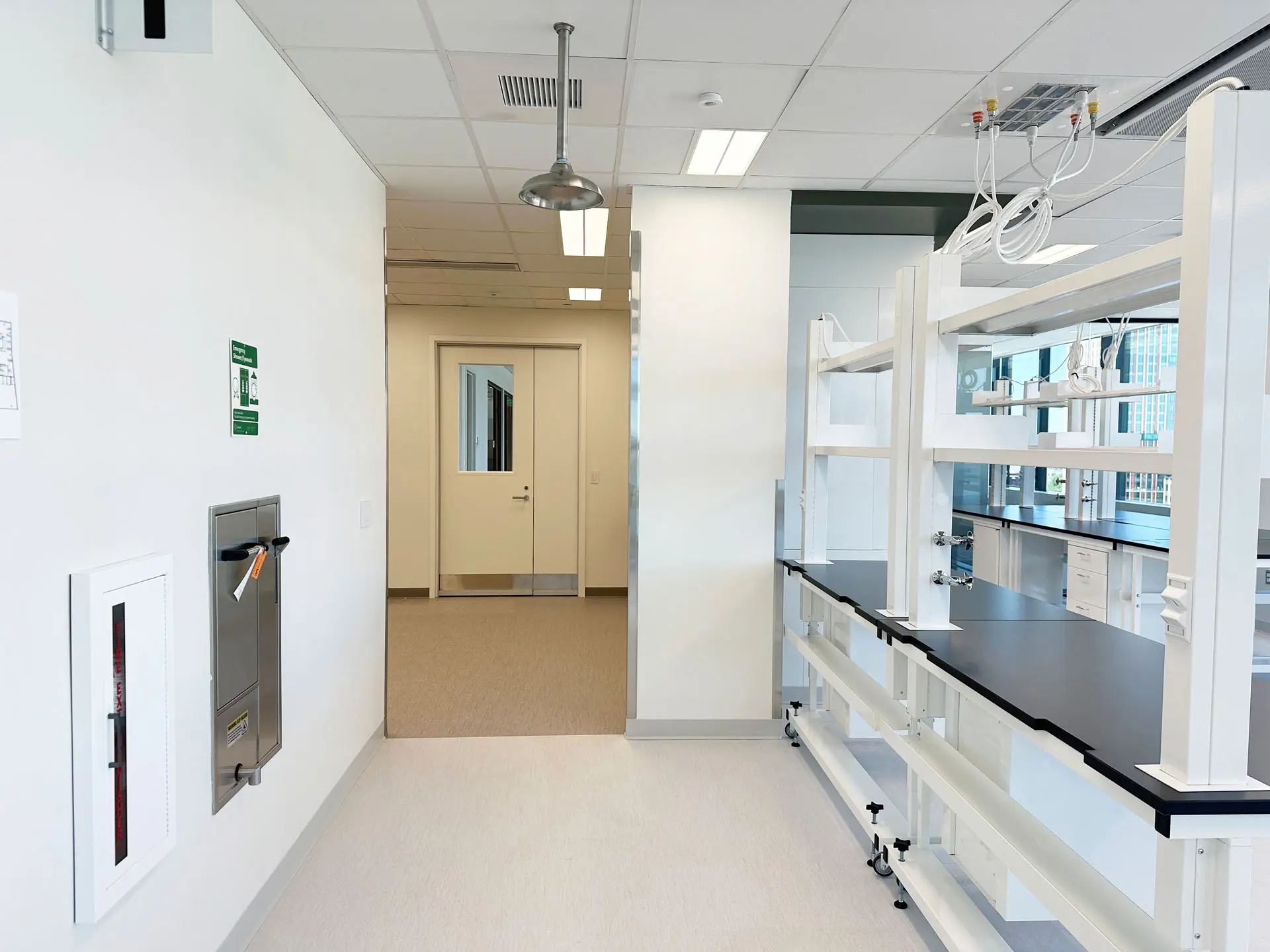 Laboratory space with tiled floors and black countertops