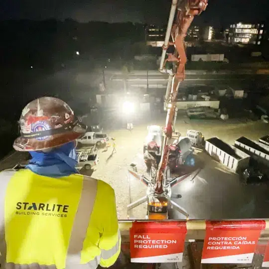 Starlite employee on balcony overlooking concrete machine