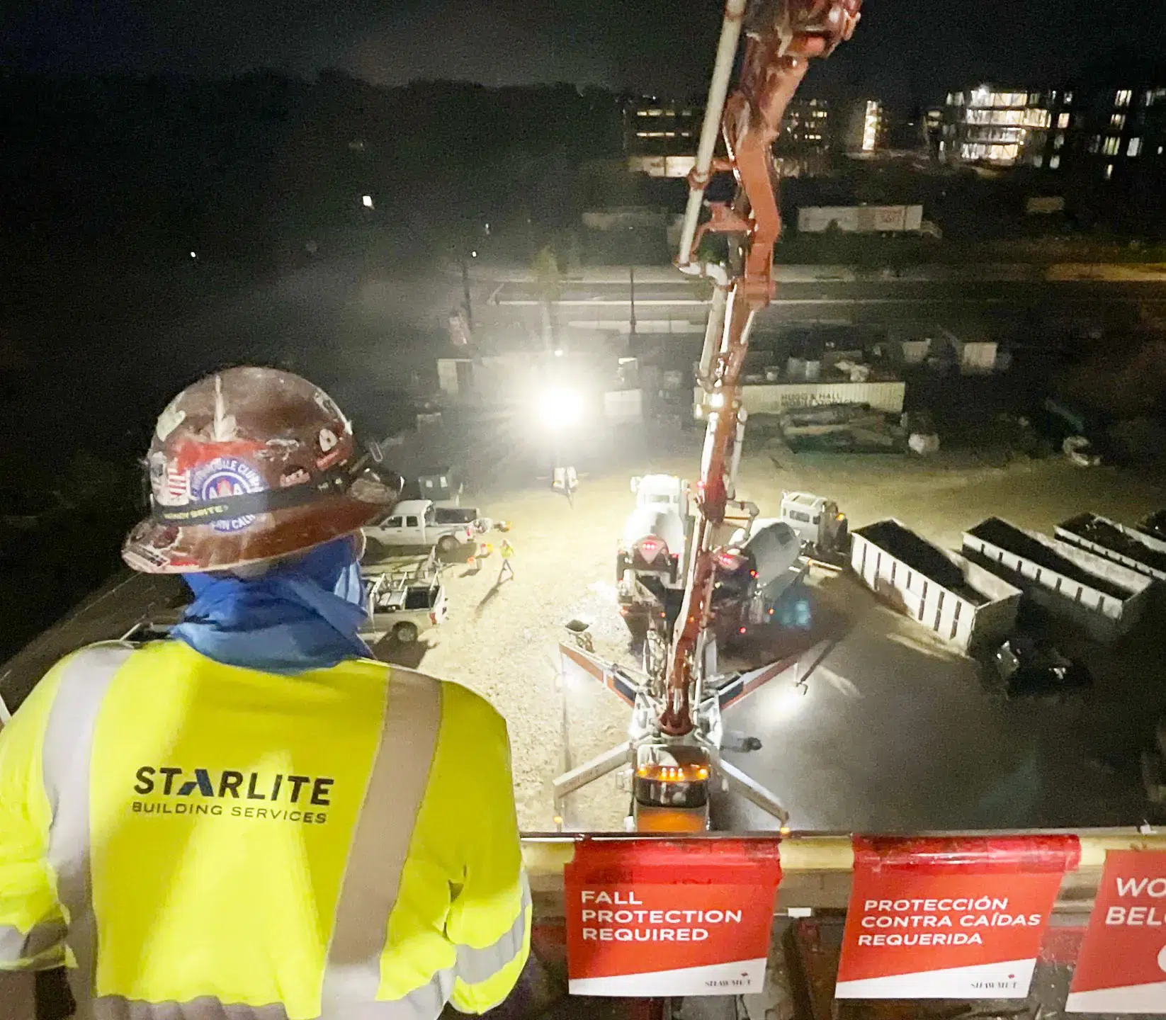Starlite employee on balcony overlooking concrete machine